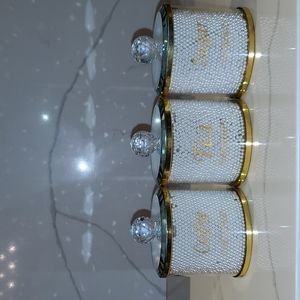 Tea, sugar, and coffee containers set